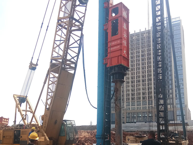 Hydraulic impact hammer for precast piles